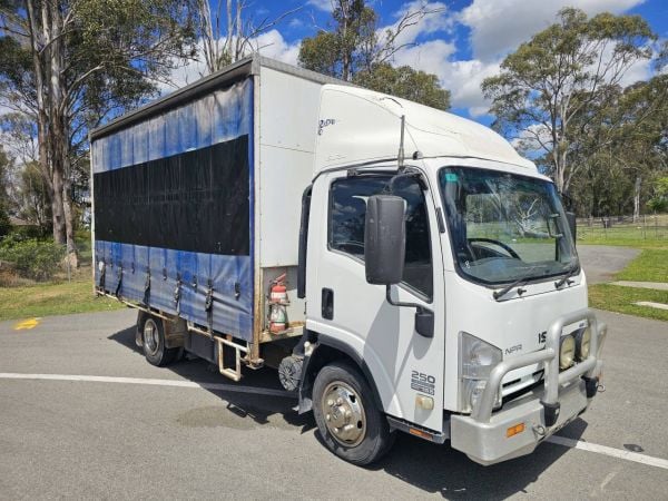 2010 Isuzu NPR 250 turbo diesel car licence 6 pallet curtainsider truck image